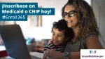 Woman and child looking at laptop